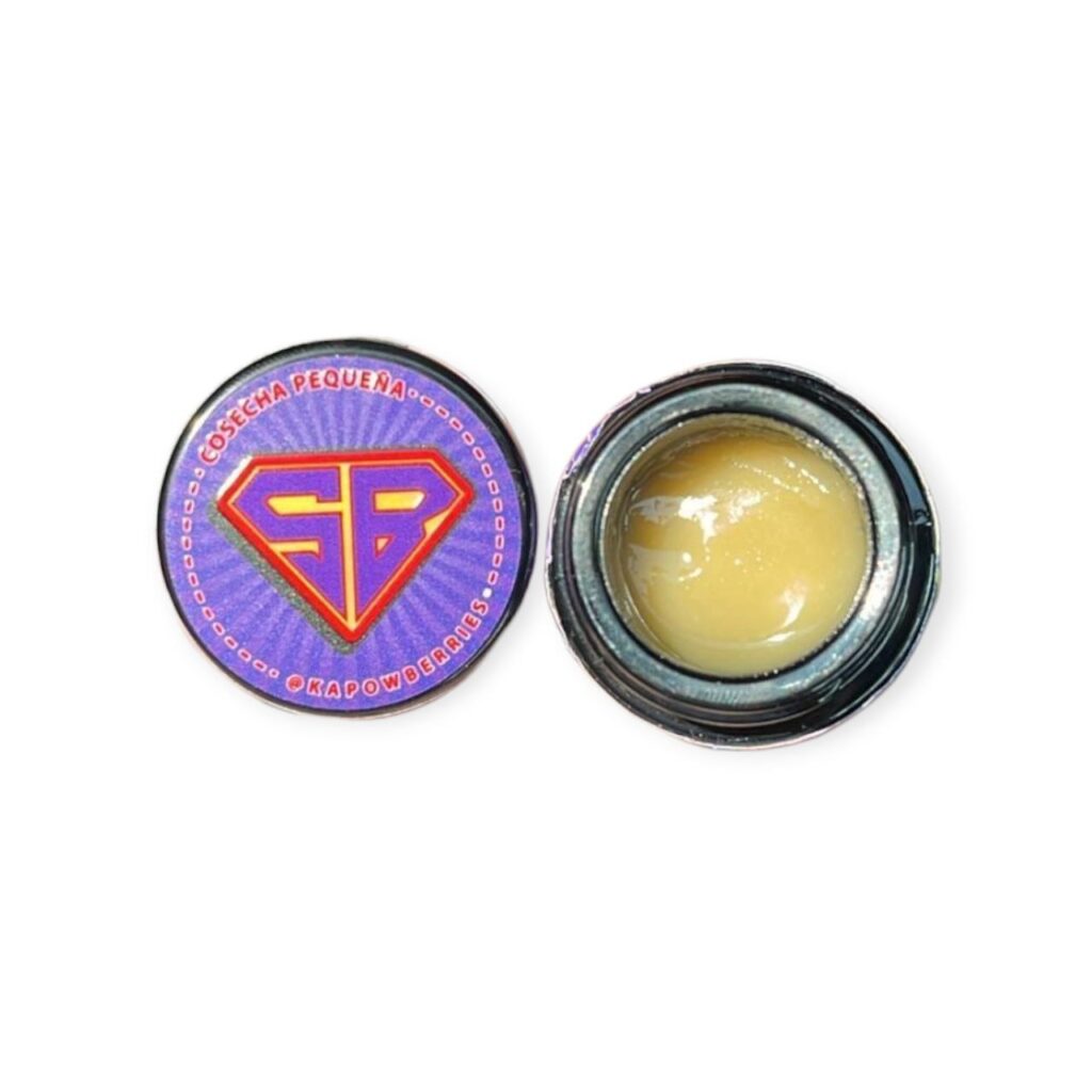 Golden, cold-cured THCa hash rosin in a glass jar labeled Kapow Berries, with creamy texture and berry-forward terpene profile