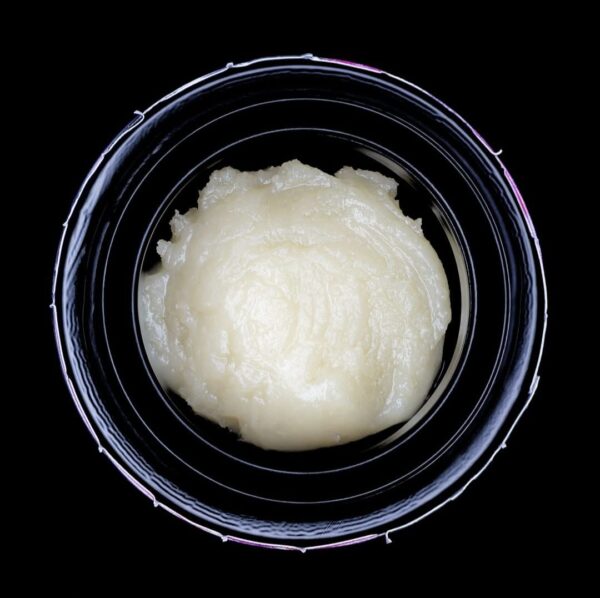 Golden THCa live rosin concentrate with lemon and berry flavor notes