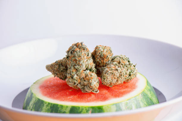 Melon Berries cannabis strain buds with frosty trichomes, green and purple hues, and sweet melon-berry aroma