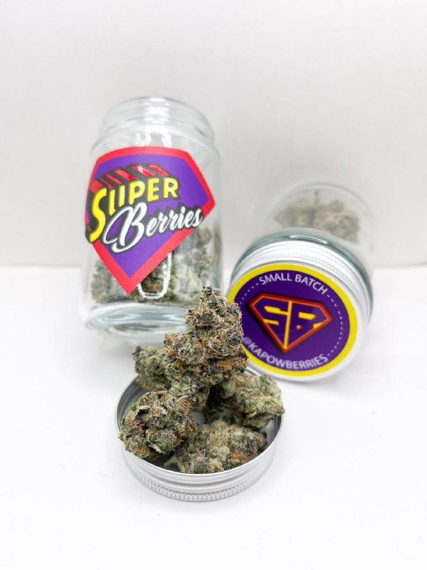 Kapow Berries boutique cannabis flower displayed with fresh berries and citrus fruits.