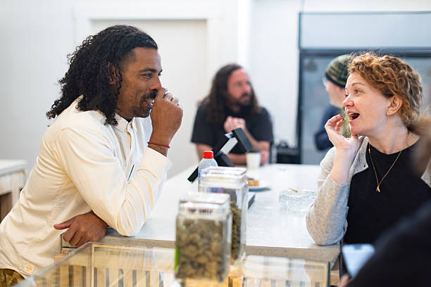 A glass bowl filled with Greek yogurt and topped with a generous serving of mixed blueberries and raspberries, with honey drizzled over the top.