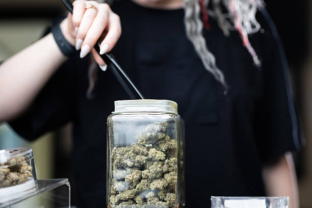  A close-up shot of fresh, glossy blueberries, raspberries, and strawberries arranged artfully on a white surface.