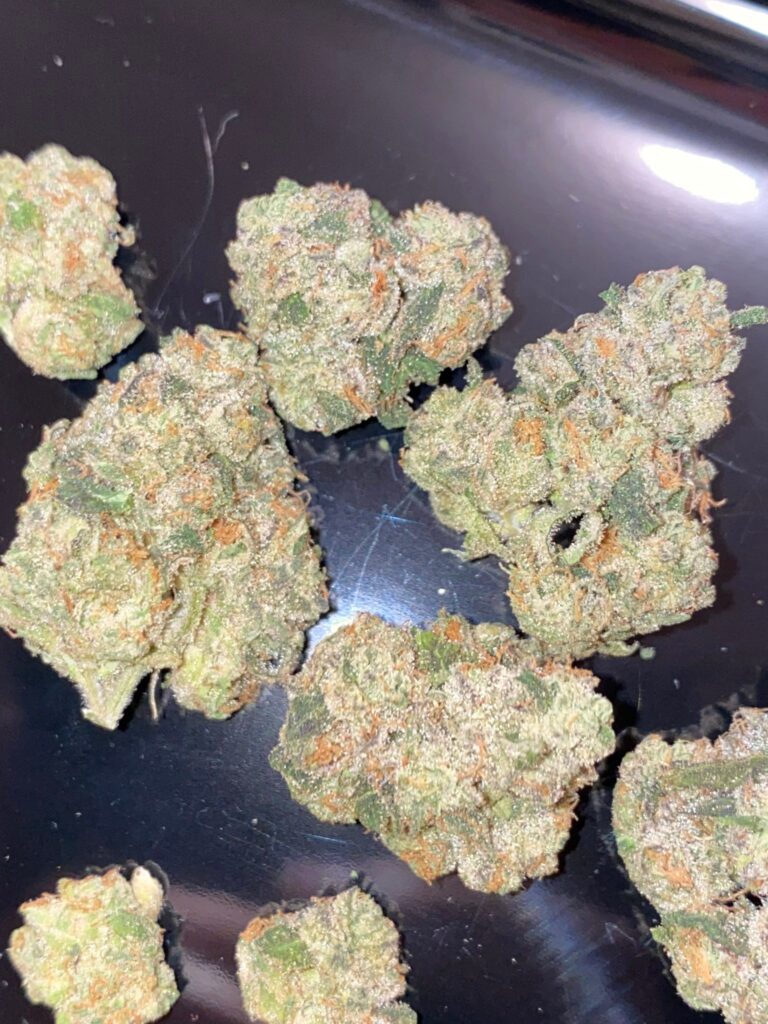 The Zangria Terpene Profile: Understanding the Science Behind the Flavor Premium 7g glass jar of Zangria boutique THCa flower by Kapow Based on a dark background